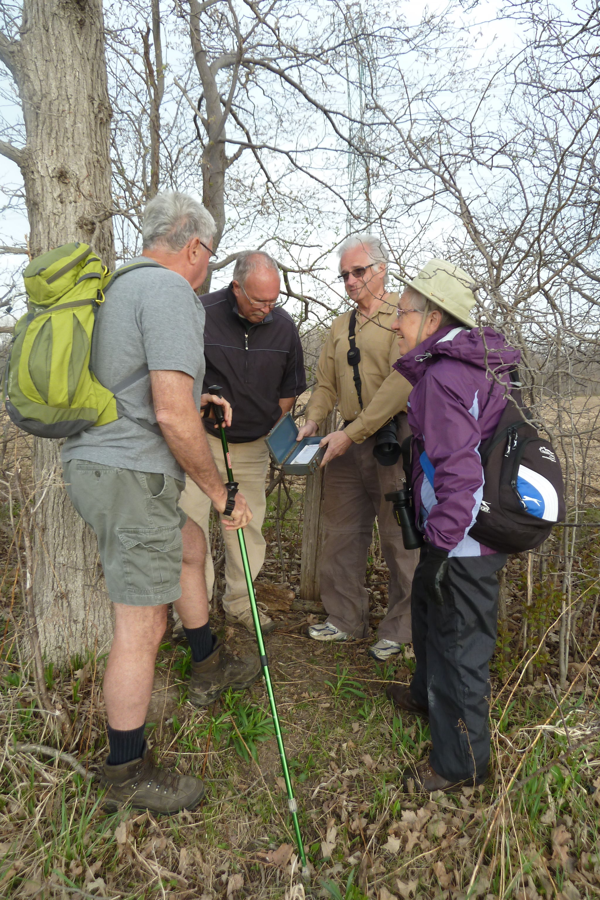 Mark showing a geocache to hikers from West Elgin Nature Club.